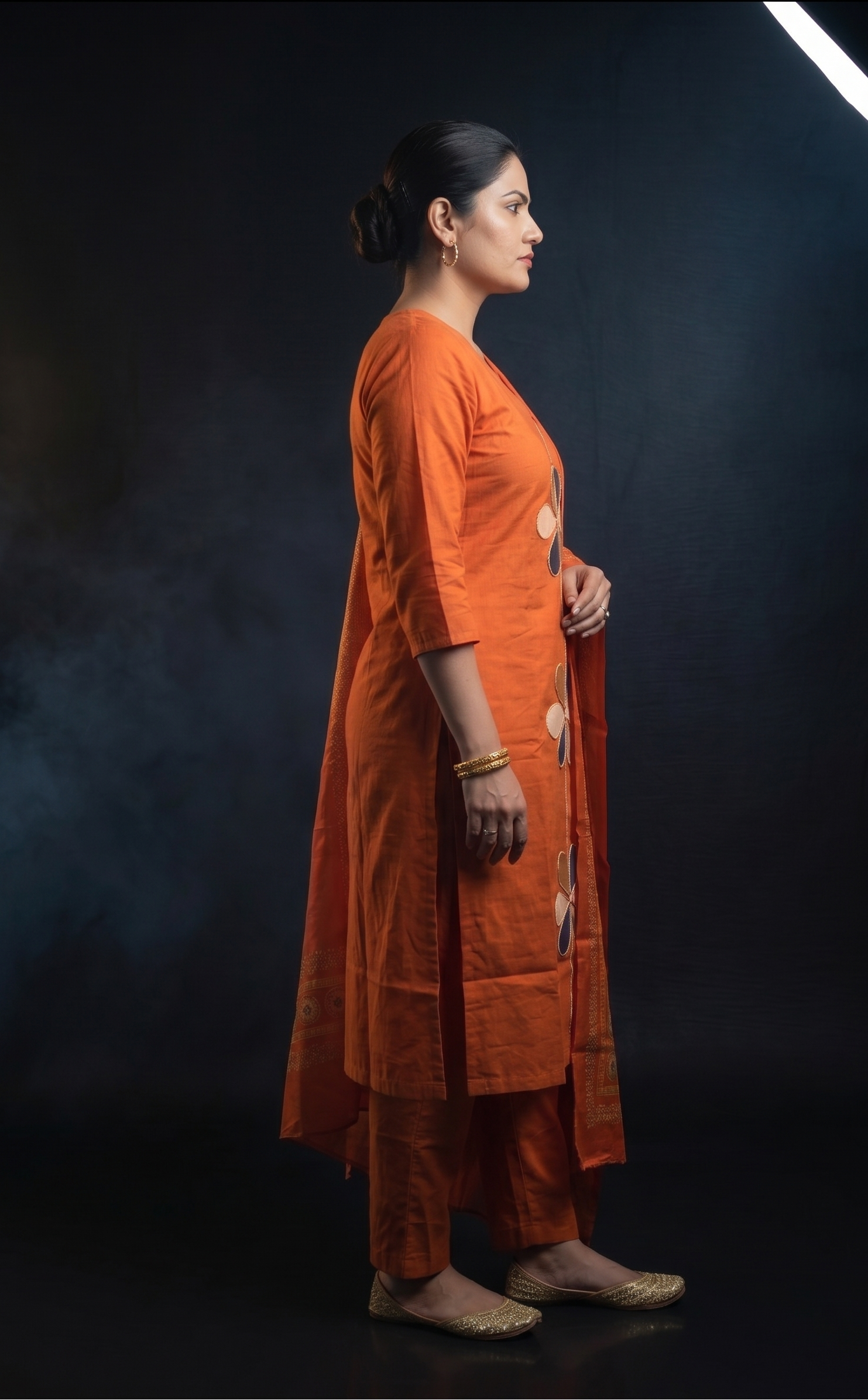 Rust orange kurta with floral appliqué work and slim-fit pants – Navratri wear